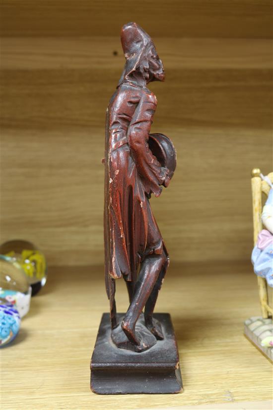 An 18th century Italian painted wood figure with a hurdy-gurdy H.29cm.